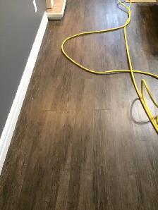 a Brand new glue down vinyl planks-ideal for basement water resi - Photo 2