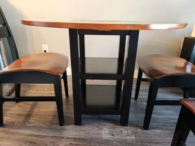 Small dining room set. Walnut and black colored.