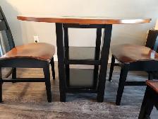Small dining room set. Walnut and black colored.