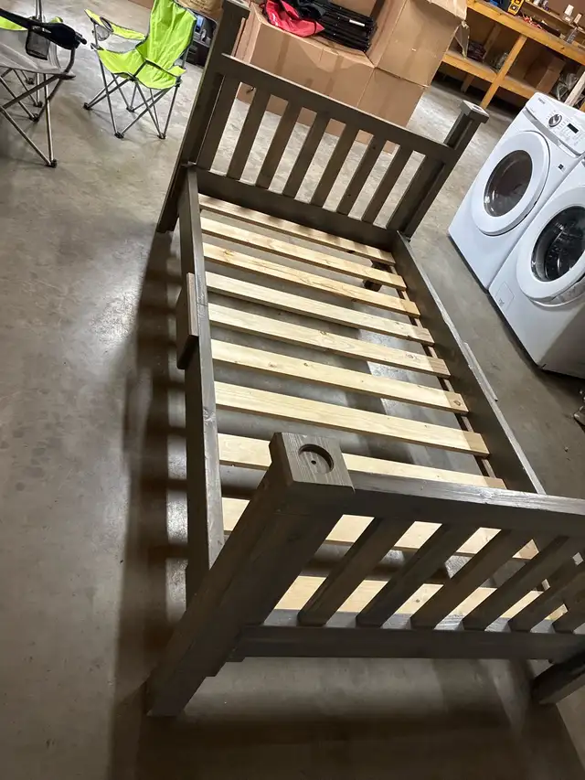 twin bed with mattress and bedding