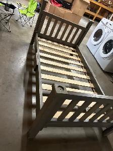 twin bed with mattress and bedding