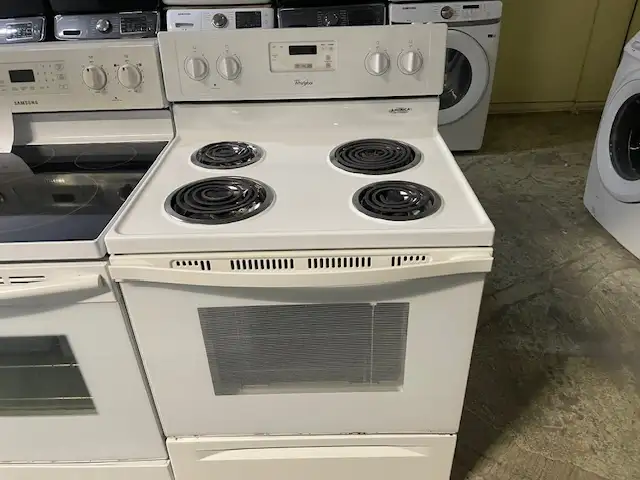 Cuisinière blanche ronds serpentins Whirlpool