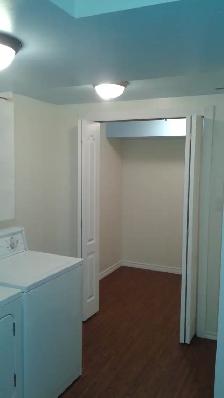 Spacious Split Level 1 Bedroom Basement with Storage & Fireplace - Photo 10