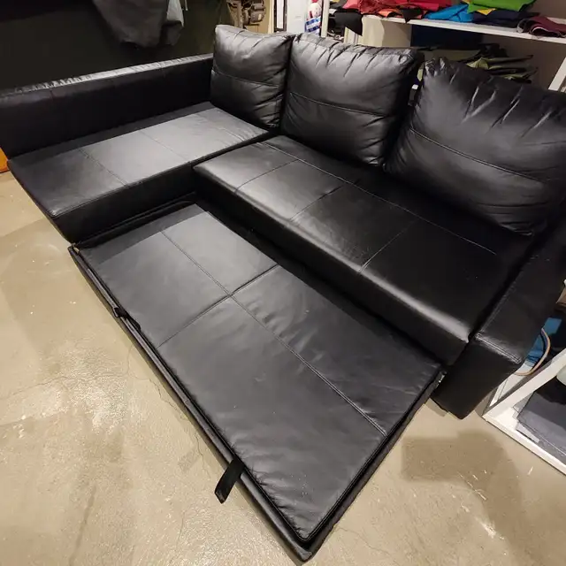 EXCELLENT Black leather IKEA sectional sofa bed   FREE DELIVERY