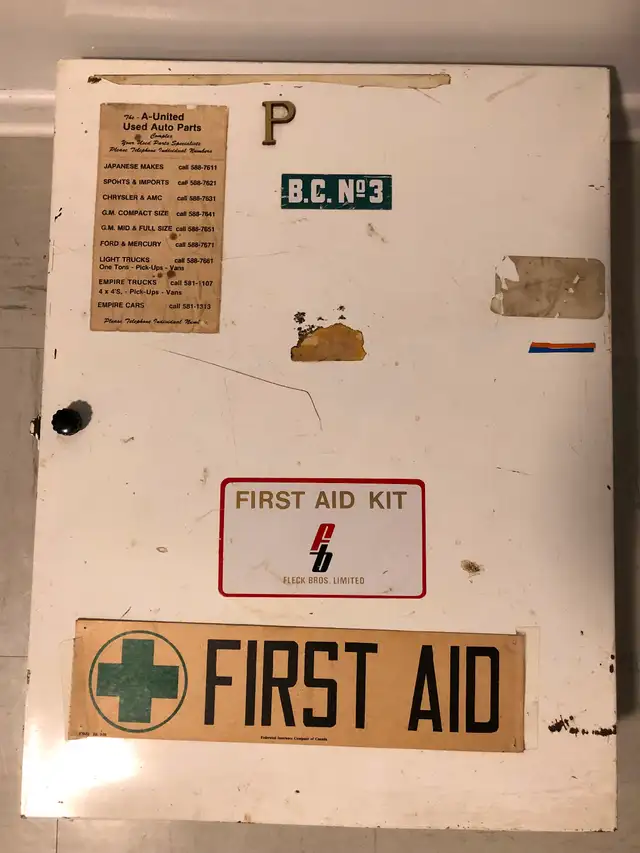 Antique commercial FirstAid metal box with all supplies inside.
