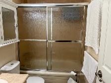 CHROME, FRAMED BATHTUB SLIDING DOORS - RAIN DROP GLASS DESIGN