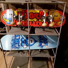2 skateboards by World Industries with shelfs