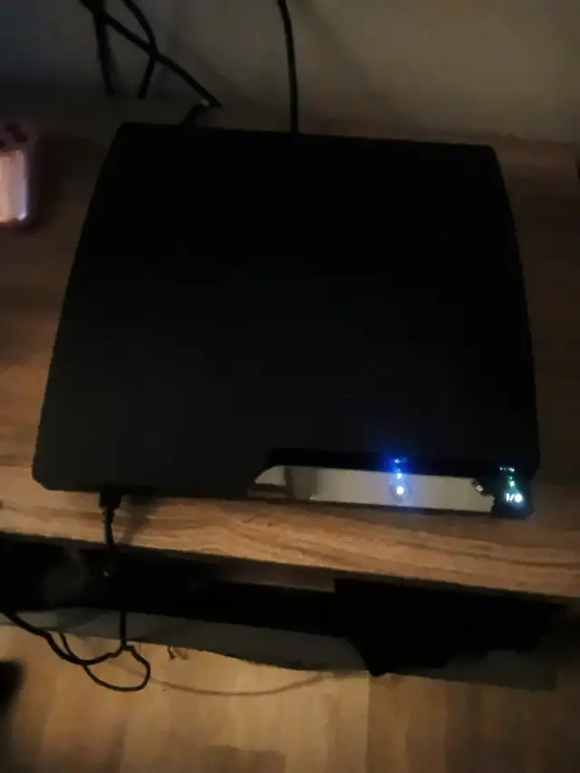 Sony PlayStation 3 Console with Two Controllers
