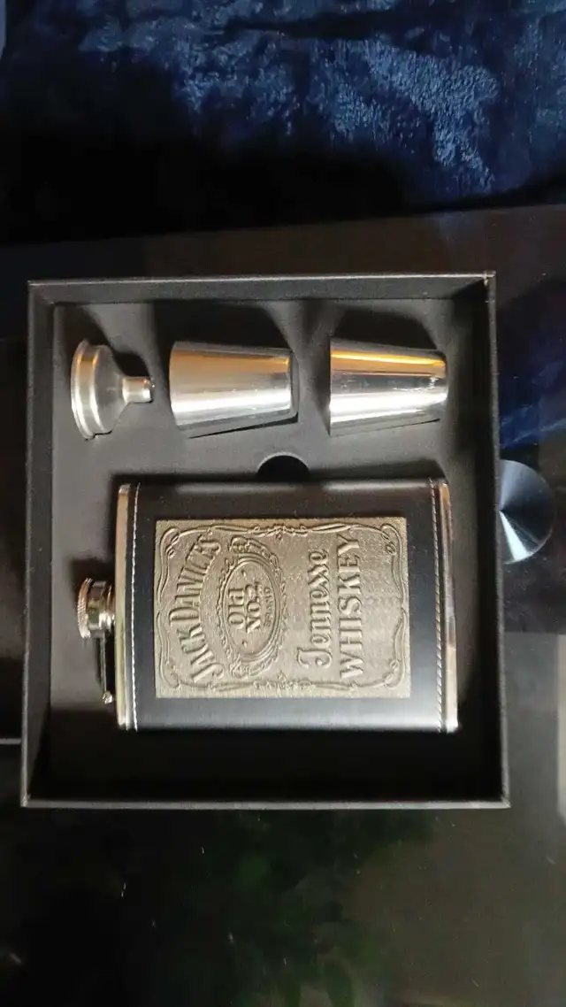 Flask set in lether cover