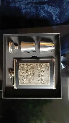 Flask set in lether cover