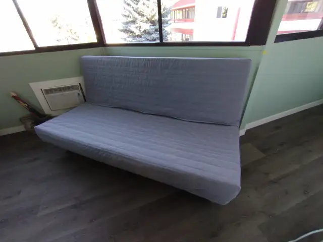 $100 Queen-size IKEA folding sofa/futon bed with cover