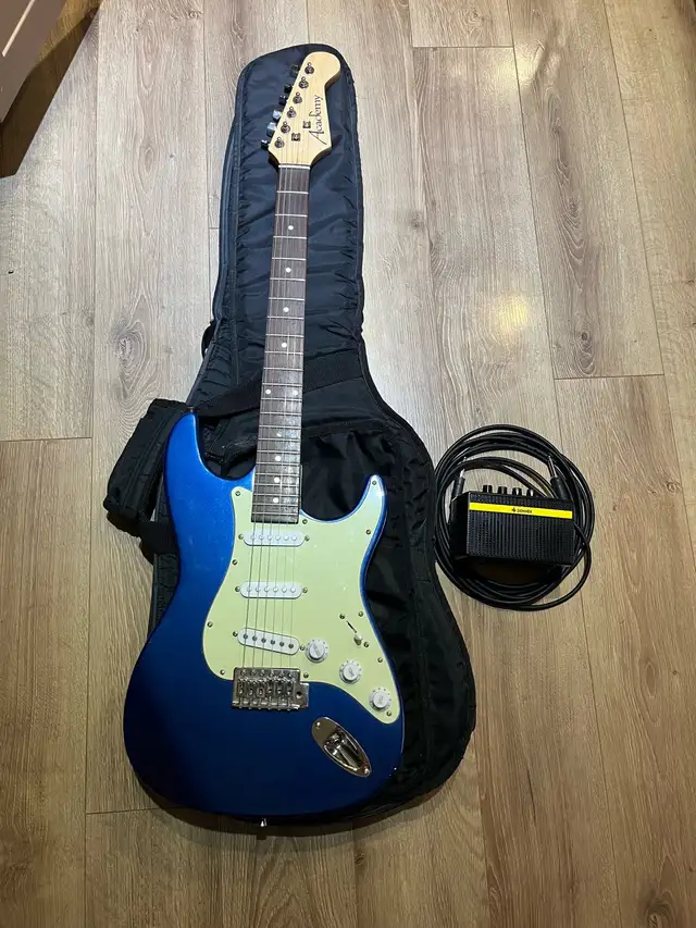 Academy Strat style electric guitar w/  gig bag and practice amp