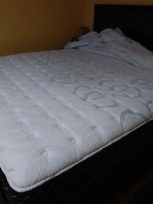 Newer king sized bed with mattress, box spring, and back board. - Photo 3