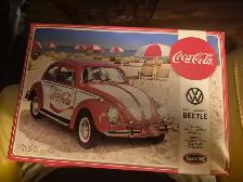 2 Coca-Cola plastic car models