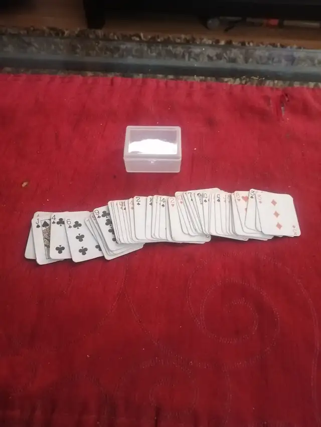 Miniature playing cards plus a game