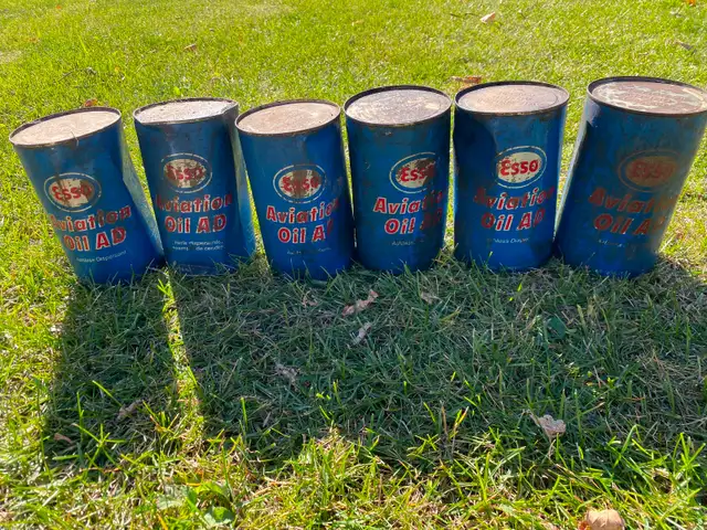 Six Esso aviation oil  cans vintage with product