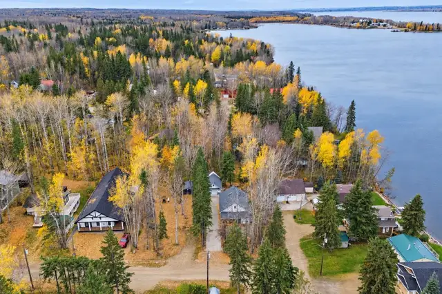 0.169 Acre Isle Lake Lot with Lake View 2 Bed Home and Dock