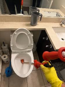 Unclogging Toilet