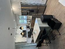 # Beautiful Furnished 2-Bedroom Upper Suite with Modern Kitchen - Photo 11