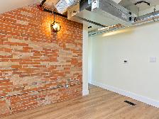 Beautiful 1-Bedroom Loft | Exposed Brick & Scenic Views | Lakefi - Photo 12