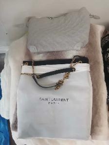Two purses have wallets as well