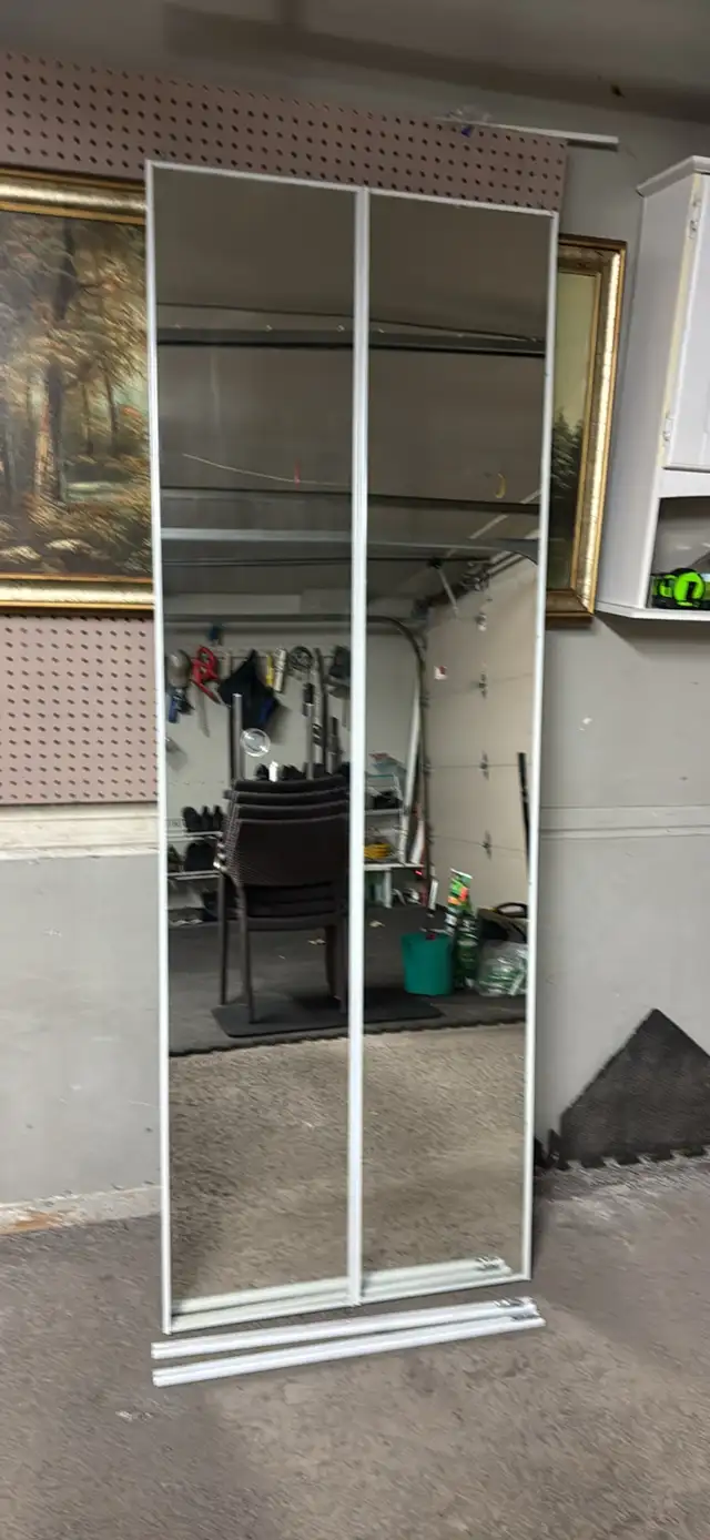 Coat closet mirrored folding doors
