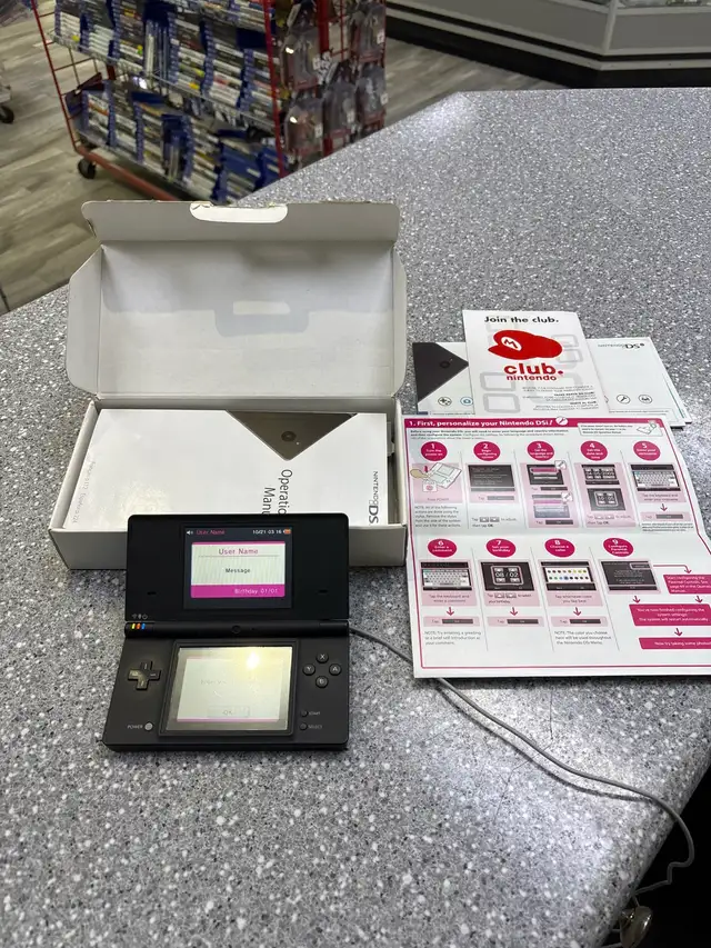 Nintendo DSi system black in box.
