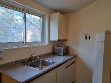 Charming 1 Bedroom   Den | Main Floor & Parking - Photo 3