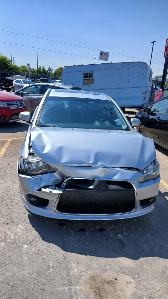 Salvaged 2015 Mitsubishi Lancer for sale