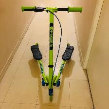 Green Yvolution 3-Wheel Scooter. Fits kids 5–8 years o