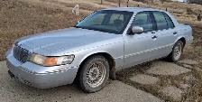 2002 Mercury Grand Marquis.  213,000K.  4.6 Liter engine.