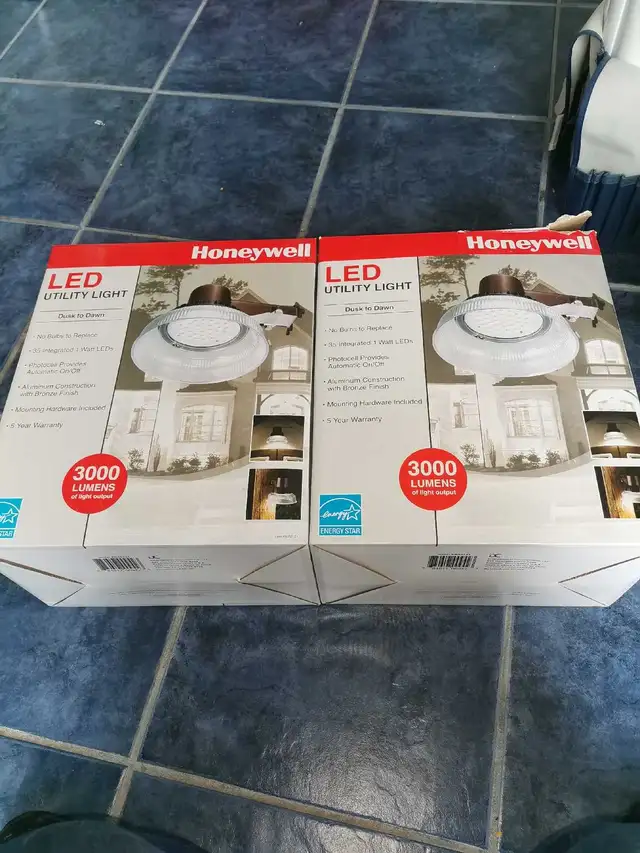 Led utility lights Dusk to Dawn New in box