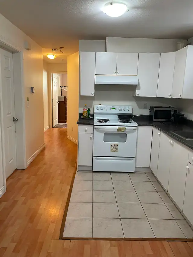 Bright private furnished BR in 2 BR bsmt suite by Joyce Station