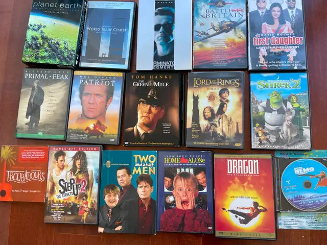 A boxful  of 18 various  DVD movies