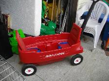 2 SEAT LITTLE RED WAGON WITH SOLID WHEELS AND SEAT BELTS...