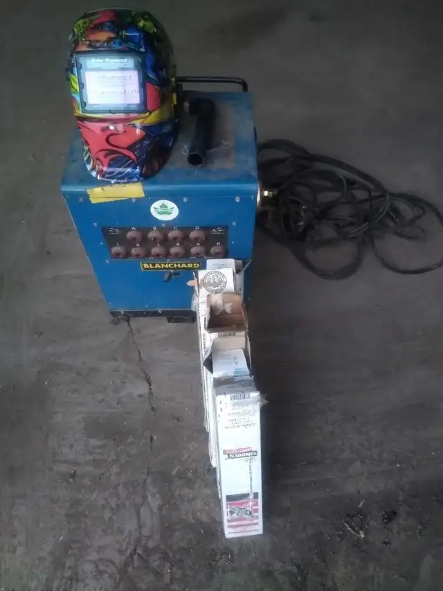 Complete stick welder with auto darkening helmet and rods