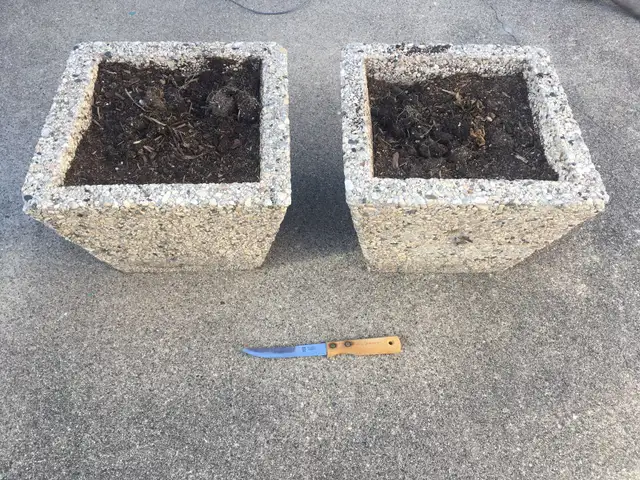 Set of two heavy outdoor planters - $50 for the lot