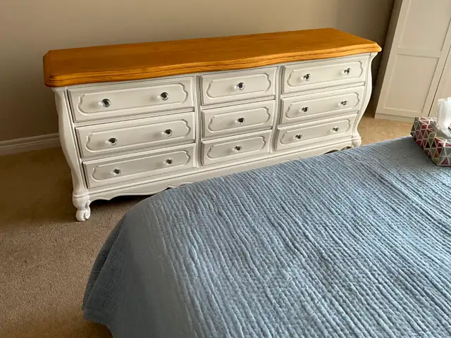 White, refurbished solid wood dresser.