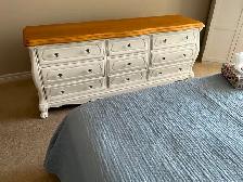 White, refurbished solid wood dresser.